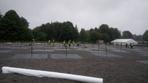 All of us hard at work laying down the geotextile and gravel on the LBA field”