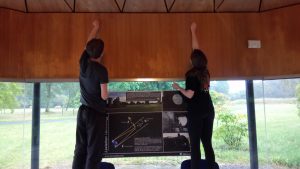 Rachel and myself putting up a poster for the exhibition in the pavilion